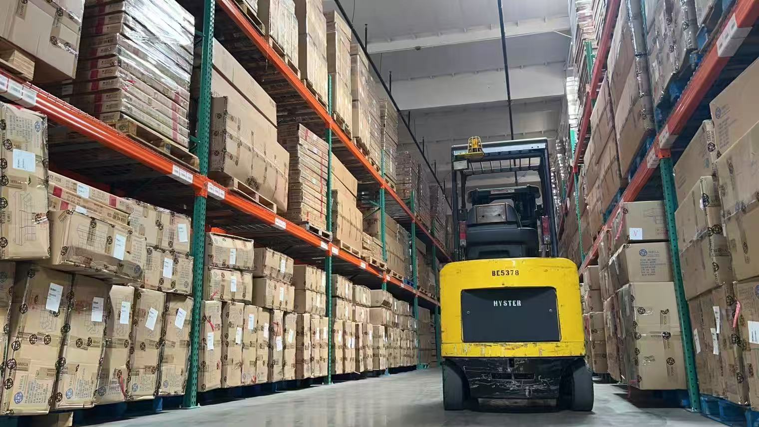Kahaya warehouse aisle with forklift and palletized inventory